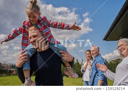 Little child is having fun with her father in grassy meadow 110129214