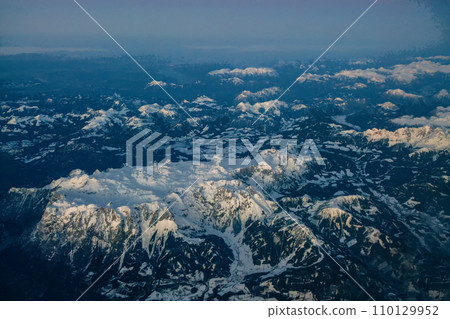 European Alps (Austrian) from window of airplane and gondola of Turbojet engine (Flying from East to German Bavaria) European Alps (Austrian) from window of airplane and gondola of Turbojet engine (Flying from East to German Bavaria) 110129952
