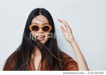 Asian woman sunglasses lifestyle hair portrait fashion model vacations beauty glamour 110130589