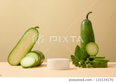 Small podium placed in the middle with winter melon surrounded. Winter melon (Benincasa hispida) also features health-promoting antioxidants Small podium placed in the middle with winter melon surrounded. Winter melon (Benincasa hispida) also features health-promoting antioxidants 110134270