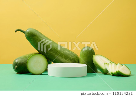 A podium in round shaped decorated with winter melon slices. Front view. Winter melon (Benincasa hispida) may help protect body against cell damage A podium in round shaped decorated with winter melon slices. Front view. Winter melon (Benincasa hispida) may help protect body against cell damage 110134281