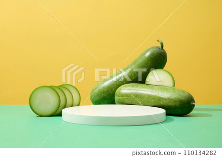 Winter melon cut in slices are displayed with a round podium. Winter melon (Benincasa hispida) is rich in vitamins, minerals, and organic compounds 110134282