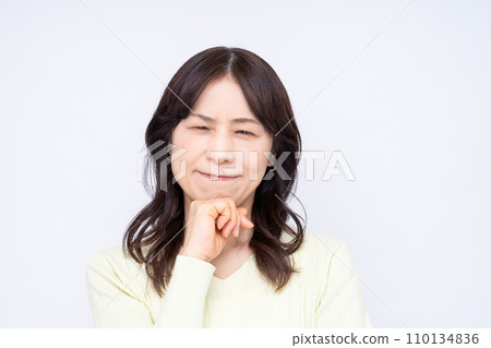 A troubled middle-aged woman 110134836
