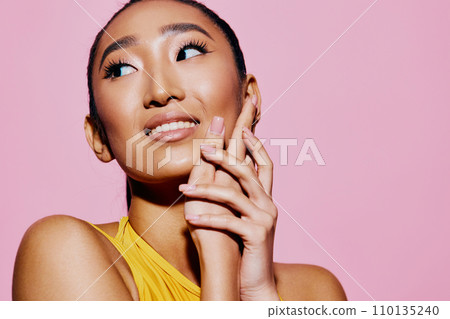 One woman yellow portrait smile trendy wow beauty fashion pink surprised person lifestyle One woman yellow portrait smile trendy wow beauty fashion pink surprised person lifestyle 110135240