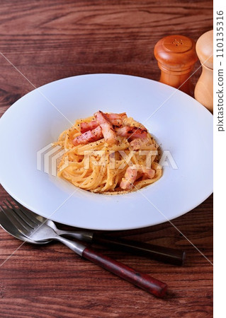 Carbonara. Italian, pasta, spaghetti, pasta with egg and bacon and cheese and black pepper. Carbonara. Italian, pasta, spaghetti, pasta with egg and bacon and cheese and black pepper. 110135316