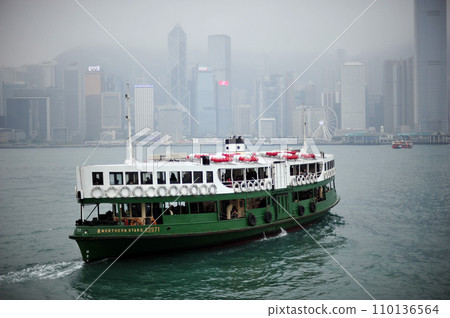 Star Ferry sailing through Victoria Harbour. Star Ferry sailing through Victoria Harbour. 110136564