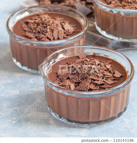 Chocolate dessert Panna Cotta in glass ramekin, square Chocolate dessert Panna Cotta in glass ramekin, square 110143196