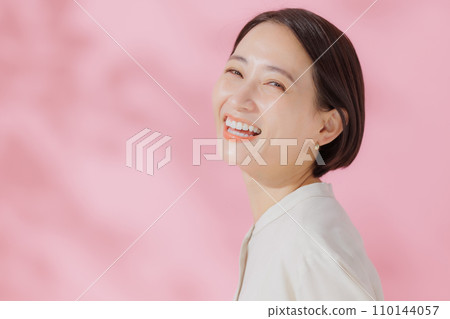 Female portrait pink back 110144057