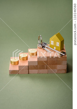 A small wooden house and keys as an idea for investing in your own home A small wooden house and keys as an idea for investing in your own home 110146560