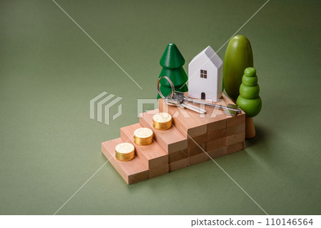 A small wooden house and keys as an idea for investing in your own home A small wooden house and keys as an idea for investing in your own home 110146564