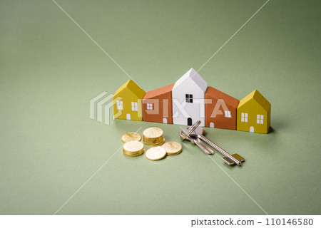 A small wooden house and keys as an idea for investing in your own home 110146580