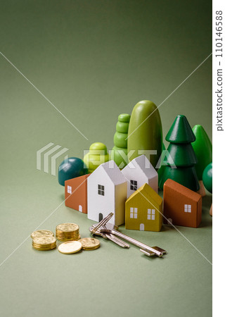 A small wooden house and keys as an idea for investing in your own home 110146588