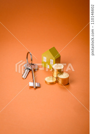 A small wooden house and keys as an idea for investing in your own home 110146602