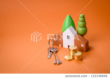 A small wooden house and keys as an idea for investing in your own home 110146606