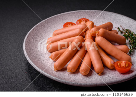 Delicious small sausages with salt, spices and herbs Delicious small sausages with salt, spices and herbs 110146629