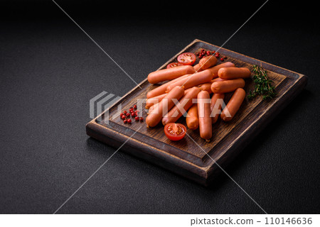 Delicious small sausages with salt, spices and herbs Delicious small sausages with salt, spices and herbs 110146636