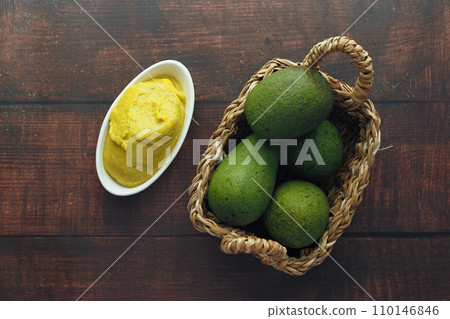 avocado and avocado pasted in a container 110146846
