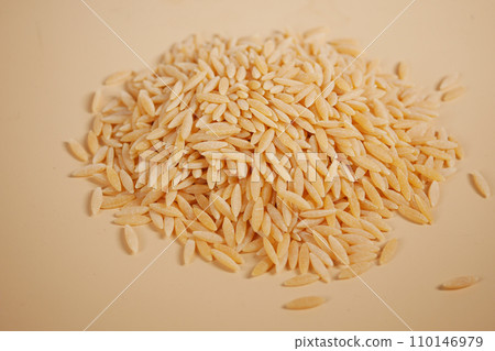 top view of brown long rice on table . top view of brown long rice on table . 110146979
