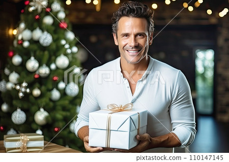 AI-generated content. A cheerful man with a gift in his hands, wearing glasses has a snow-white smile AI-generated content. A cheerful man with a gift in his hands, wearing glasses has a snow-white smile 110147145