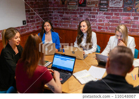 Managers discuss work assignment for ongoing project Managers discuss work assignment for ongoing project 110148007