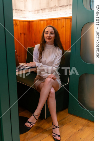 Young woman employee poses for photosession in company premise 110148025