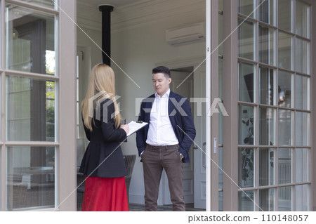 Real estate agent evaluates residence for property market Real estate agent evaluates residence for property market 110148057