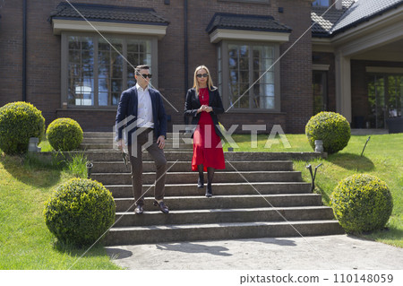 Professional real estate agents examine big cottage Professional real estate agents examine big cottage 110148059