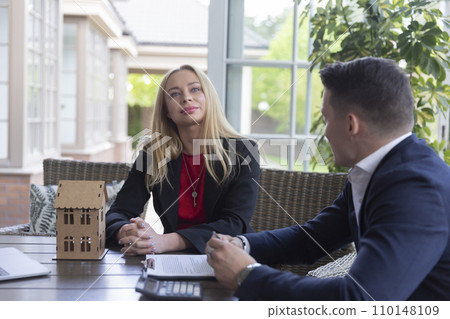 Estate agent and businessman talking about residence Estate agent and businessman talking about residence 110148109