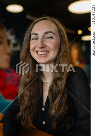 Brown-haired woman works on project in business office 110148222