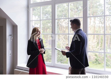 Businesswoman inspects new house with realtor support 110148330