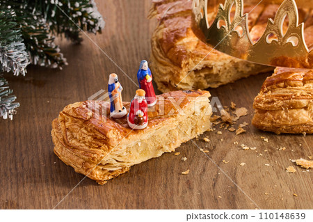 Galette des rois on wooden table.Traditional Epiphany cake in France Galette des rois on wooden table.Traditional Epiphany cake in France 110148639