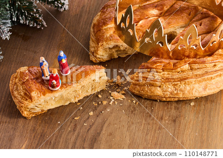 Galette des rois on wooden table.Traditional Epiphany cake in France Galette des rois on wooden table.Traditional Epiphany cake in France 110148771