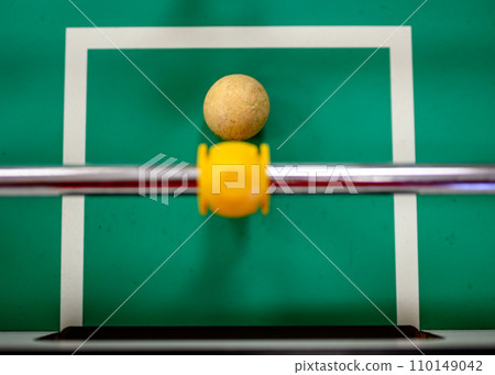 top view on a foosball goalie blocking the ball insider the box top view on a foosball goalie blocking the ball insider the box 110149042