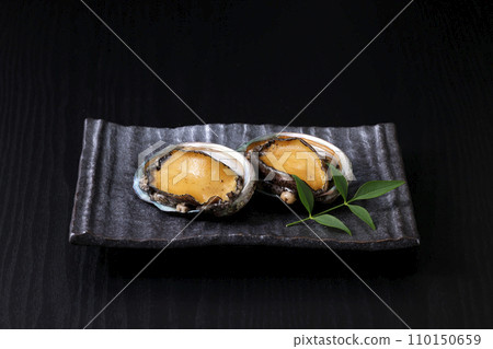 Abalone from Hokkaido placed on a black background 110150659
