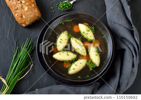 Bavarian, Swabian and Austrian dish - semolina dumplings  in a vegetable broth 110150682