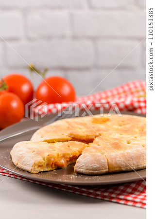Pizza calzone on wooden background Pizza calzone on wooden background 110151385