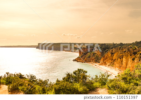 Sunset over the cliffs and beaches 110151397