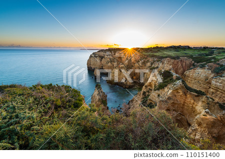 Sunset over the cliffs and beaches 110151400