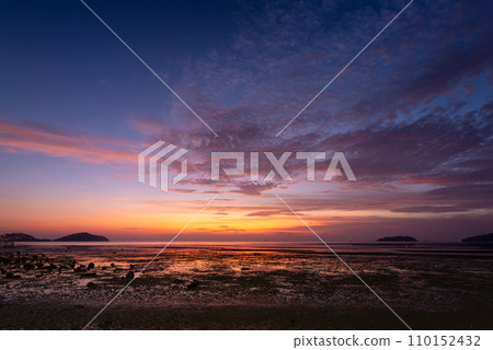 Beautiful sky in the morning at Saphanhin public beach, Phuket, Thailand. Beautiful sky in the morning at Saphanhin public beach, Phuket, Thailand. 110152432
