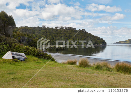 Seaside landscape with camping site in Stewart Island, New Zealand Seaside landscape with camping site in Stewart Island, New Zealand 110153276
