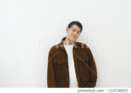 Man in his 30s looking at camera, white background portrait 110156093