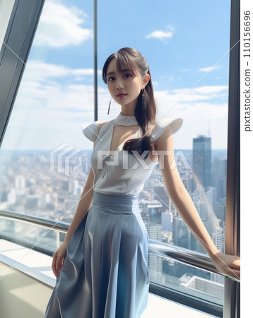 A woman standing on the observation deck of a skyscraper A woman standing on the observation deck of a skyscraper 110156696