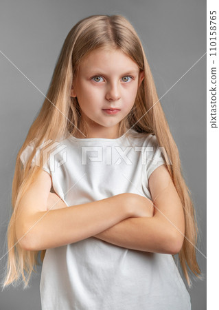 Portrait of sad little girl in white t-shirt 110158765