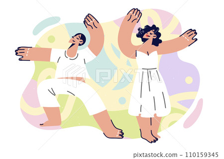 Dancing couple of man and woman performs dance together making movements from kizomba or mamba Dancing couple of man and woman performs dance together making movements from kizomba or mamba 110159345