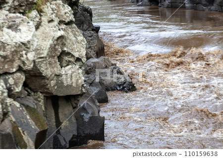 Rocks and water in the river in the rainy season. Nature background Rocks and water in the river in the rainy season. Nature background 110159638