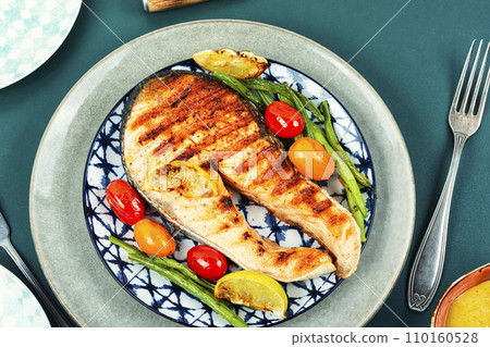 Plate of grilled salmon steak. Plate of grilled salmon steak. 110160528