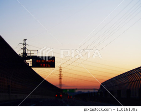 Sunset sky and highway silhouette 110161392