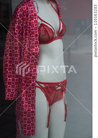 closeup of red underwear with little hearts on mannequin in a fashion store showroom 110163283