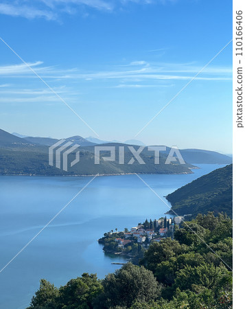 Green mountains between blue sea and sky 110166406