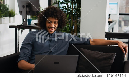 Analyst celebrating successful win in coworking space, feeling proud about business achievement or victory. Professional manager enjoying progress to develop career, job satisfaction. 110167114